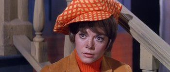 Movie still from “Inside Daisy Clover” (1965), directed by Robert Mulligan – A person wearing an orange hat; Close Up shot, High angle