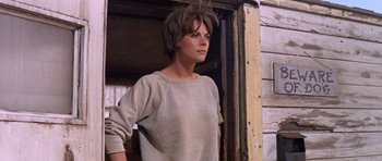 Movie still from “Inside Daisy Clover” (1965), directed by Robert Mulligan – A woman standing in front of a building; Medium shot, Low angle