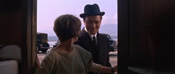 Movie still from “Inside Daisy Clover” (1965), directed by Robert Mulligan – A man in a suit and a woman in a hat; Medium shot, Over the shoulder angle