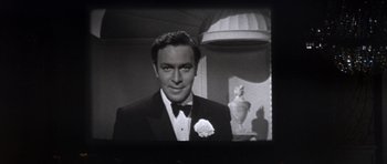 Movie still from “Inside Daisy Clover” (1965), directed by Robert Mulligan – A black and white photo of a man in a tuxedo; Close Up shot, Low angle