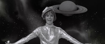 Movie still from “Inside Daisy Clover” (1965), directed by Robert Mulligan – A black and white photo of a woman in a space suit; Medium shot, Low angle