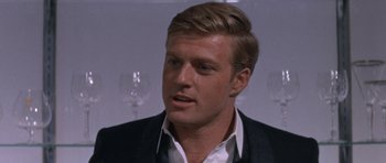 Movie still from “Inside Daisy Clover” (1965), directed by Robert Mulligan – A person wearing a suit and tie; Close Up shot, Over the shoulder angle