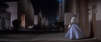 Movie still from “Inside Daisy Clover” (1965), directed by Robert Mulligan – A woman walking down a street at night; Wide shot, Low angle