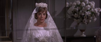Movie still from “Inside Daisy Clover” (1965), directed by Robert Mulligan – A woman wearing a wedding dress and a veil; Close Up shot, High angle