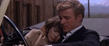 Movie still from “Inside Daisy Clover” (1965), directed by Robert Mulligan – A man and a woman sitting next to each other; Close Up shot, Low angle