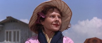 Movie still from “Inside Daisy Clover” (1965), directed by Robert Mulligan – An older woman wearing a hat and a scarf; Close Up shot, Low angle