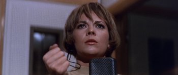 Movie still from “Inside Daisy Clover” (1965), directed by Robert Mulligan – A person holding a pair of eyeglasses; Close Up shot, Low angle