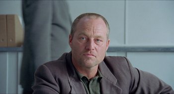 Movie still from “Insomnia” (1997), directed by Erik Skjoldbjærg – A person wearing a jacket; Close Up shot, Low angle