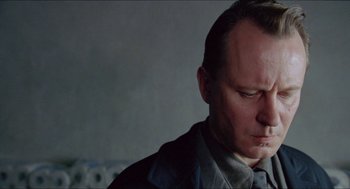 Movie still from “Insomnia” (1997), directed by Erik Skjoldbjærg – A person with his eyes closed; Close Up shot, Low angle