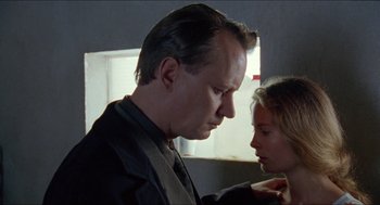 Movie still from “Insomnia” (1997), directed by Erik Skjoldbjærg – A man and a woman looking at one another; Close Up shot, Low angle