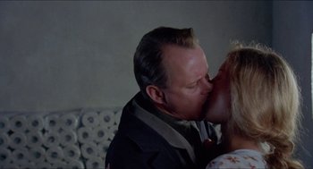 Movie still from “Insomnia” (1997), directed by Erik Skjoldbjærg – A man and a woman kissing in a room; Close Up shot, Low angle
