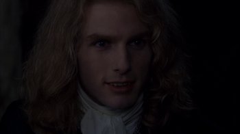 Movie still from “Interview with the Vampire: The Vampire Chronicles” (1994), directed by Neil Jordan – A person with long blonde hair; Close Up shot, Over the shoulder angle