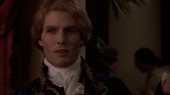 Movie still from “Interview with the Vampire: The Vampire Chronicles” (1994), directed by Neil Jordan – A person wearing a suit and tie; Close Up shot, Over the shoulder angle