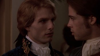 Movie still from “Interview with the Vampire: The Vampire Chronicles” (1994), directed by Neil Jordan – A man in a black and white shirt and a man in a black and white shirt; Close Up shot, Over the shoulder angle