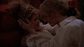 Movie still from “Interview with the Vampire: The Vampire Chronicles” (1994), directed by Neil Jordan – A man and a woman in a white dress; Close Up shot, Over the shoulder angle