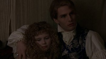 Movie still from “Interview with the Vampire: The Vampire Chronicles” (1994), directed by Neil Jordan – A man and a woman sitting next to each other; Close Up shot, High angle