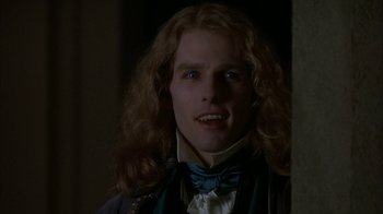 Movie still from “Interview with the Vampire: The Vampire Chronicles” (1994), directed by Neil Jordan – A person with long curly hair; Close Up shot, Over the shoulder angle