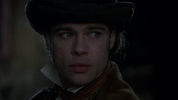 Movie still from “Interview with the Vampire: The Vampire Chronicles” (1994), directed by Neil Jordan – A person wearing a hat; Close Up shot, Low angle