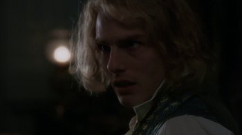 Movie still from “Interview with the Vampire: The Vampire Chronicles” (1994), directed by Neil Jordan – A person with long blonde hair; Close Up shot, Over the shoulder angle