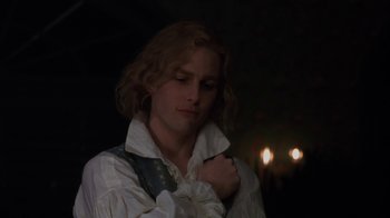 Movie still from “Interview with the Vampire: The Vampire Chronicles” (1994), directed by Neil Jordan – A man in a white shirt and a black and white shirt; Close Up shot, Over the shoulder angle