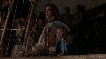 Movie still from “Interview with the Vampire: The Vampire Chronicles” (1994), directed by Neil Jordan – A man and a little girl sitting on a boat; Medium shot, Low angle