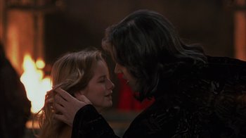 Movie still from “Interview with the Vampire: The Vampire Chronicles” (1994), directed by Neil Jordan – A woman and a man are kissing each other; Close Up shot, Over the shoulder angle