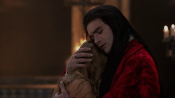 Movie still from “Interview with the Vampire: The Vampire Chronicles” (1994), directed by Neil Jordan – A man and a woman embracing each other; Close Up shot, Over the shoulder angle