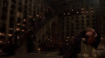 Movie still from “Interview with the Vampire: The Vampire Chronicles” (1994), directed by Neil Jordan – A group of people standing on a staircase in a room; Extreme Wide shot, High angle