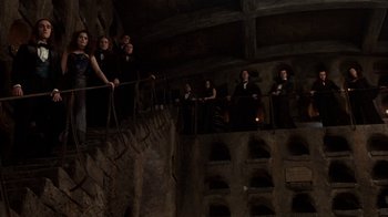Movie still from “Interview with the Vampire: The Vampire Chronicles” (1994), directed by Neil Jordan – A group of people standing on top of a building; Wide shot, Low angle