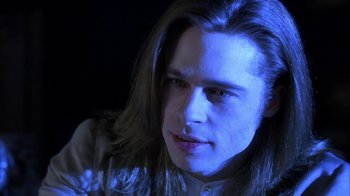 Movie still from “Interview with the Vampire: The Vampire Chronicles” (1994), directed by Neil Jordan – A man with long brown hair and blue lighting; Close Up shot, Low angle
