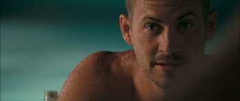 Movie still from “Into the Blue” (2005), directed by John Stockwell – A man's face in the water; Close Up shot, Over the shoulder angle
