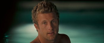 Movie still from “Into the Blue” (2005), directed by John Stockwell – A person with a beard; Close Up shot, Over the shoulder angle