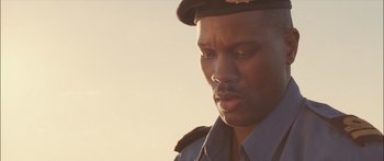 Movie still from “Into the Blue” (2005), directed by John Stockwell – A person wearing a uniform; Close Up shot, Low angle