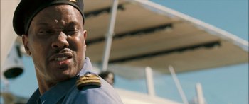 Movie still from “Into the Blue” (2005), directed by John Stockwell – A person wearing a uniform; Close Up shot, Low angle