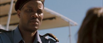Movie still from “Into the Blue” (2005), directed by John Stockwell – A person wearing a uniform; Close Up shot, Low angle