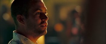 Movie still from “Into the Blue” (2005), directed by John Stockwell – A man's face in the dark; Close Up shot, Over the shoulder angle