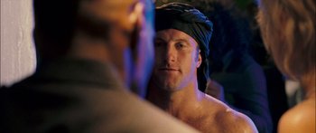 Movie still from “Into the Blue” (2005), directed by John Stockwell – A person wearing a head covering; Close Up shot, Over the shoulder angle