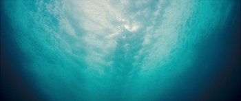 Movie still from “Into the Blue” (2005), directed by John Stockwell – A view of the sky from under the water; Extreme Wide shot, Overhead angle