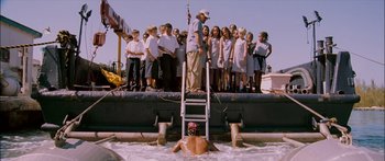 Movie still from “Into the Blue” (2005), directed by John Stockwell – A group of people standing on top of a boat; Wide shot, High angle