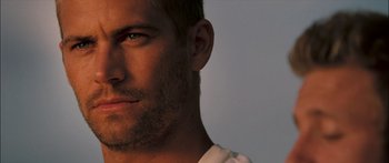 Movie still from “Into the Blue” (2005), directed by John Stockwell – A man with a beard; Close Up shot, Over the shoulder angle