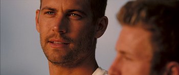 Movie still from “Into the Blue” (2005), directed by John Stockwell – A man's face with a beard; Close Up shot, Over the shoulder angle