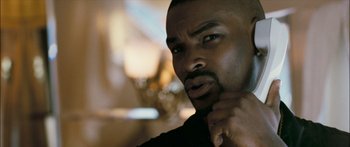 Movie still from “Into the Blue” (2005), directed by John Stockwell – A person with his hand under his chin; Close Up shot, Over the shoulder angle