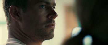 Movie still from “Into the Blue” (2005), directed by John Stockwell – A man's face looking into the distance; Extreme Close Up shot, Over the shoulder angle