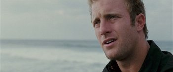 Movie still from “Into the Blue” (2005), directed by John Stockwell – A man's face near the ocean; Close Up shot, Over the shoulder angle