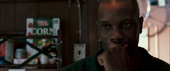 Movie still from “Into the Blue” (2005), directed by John Stockwell – A person with his hand under his chin; Close Up shot, Low angle