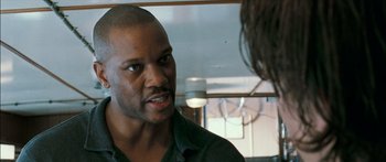 Movie still from “Into the Blue” (2005), directed by John Stockwell – A person talking to another person; Close Up shot, Over the shoulder angle