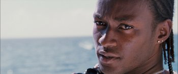 Movie still from “Into the Blue” (2005), directed by John Stockwell – A man's face on a boat; Close Up shot, Low angle