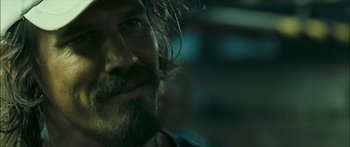 Movie still from “Into the Blue” (2005), directed by John Stockwell – A person with a beard; Close Up shot, Over the shoulder angle