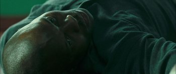Movie still from “Into the Blue” (2005), directed by John Stockwell – A man laying in a bed with his eyes closed; Close Up shot, Overhead angle