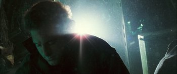 Movie still from “Into the Blue” (2005), directed by John Stockwell – The sun is shining brightly in the dark sky; Close Up shot, Low angle